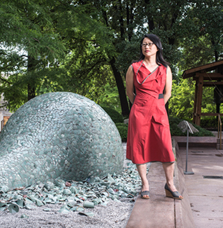 Jean Shin poses with her piece "Celadon Landscape" in Japan