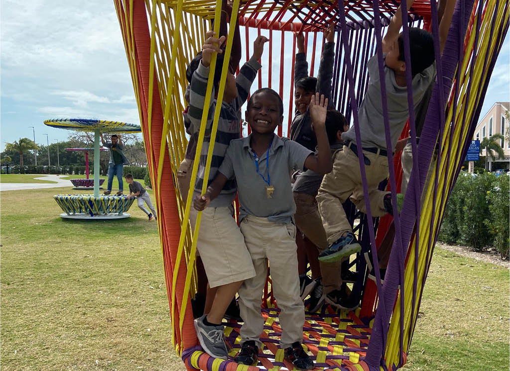 Children playing on Héctor Esrawe and Ignacio Cadena's Los Trompos, Photo: Sarasota Art Museum