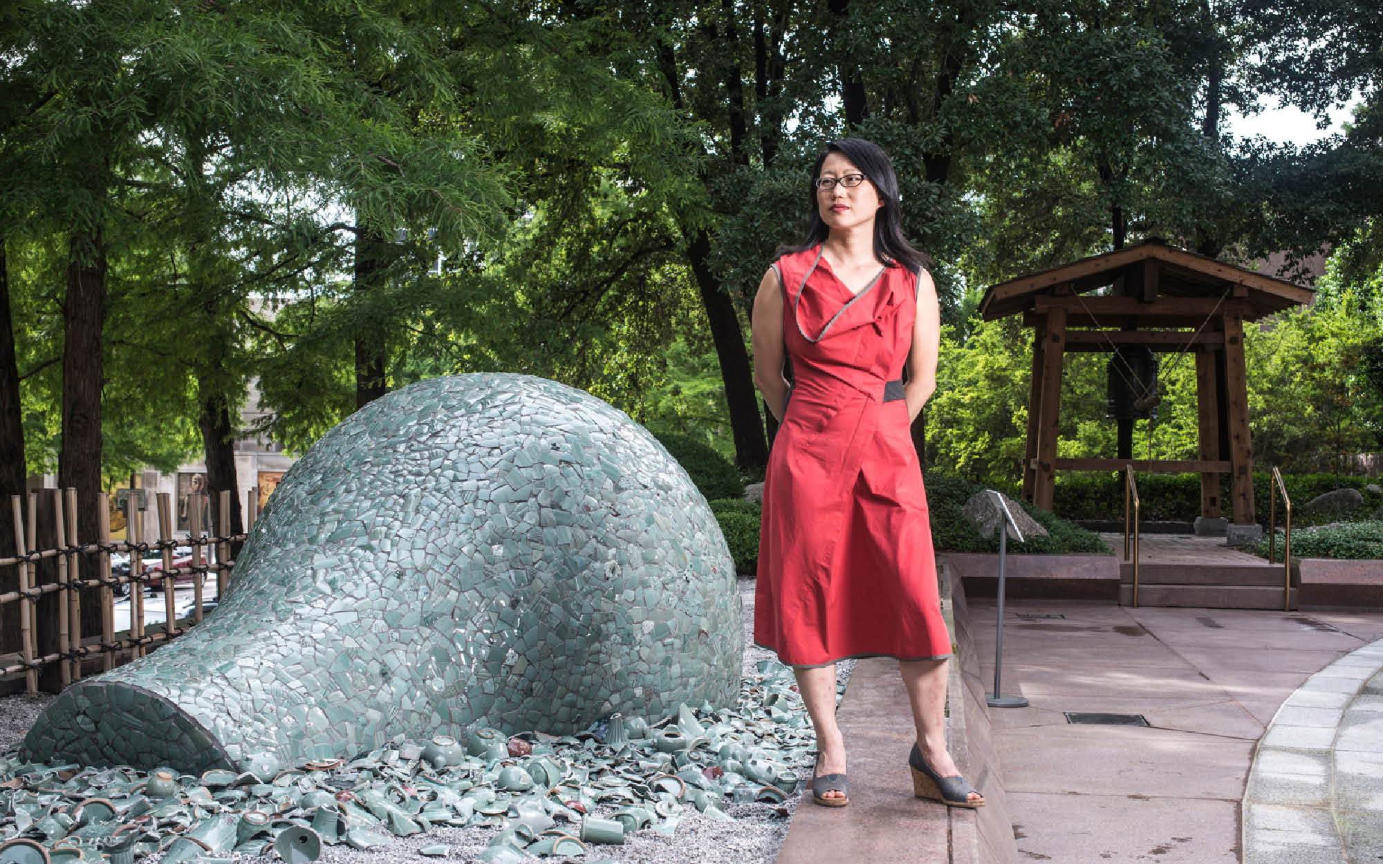 Artist Jean Shin poses with her installation "Celadon Landscape"